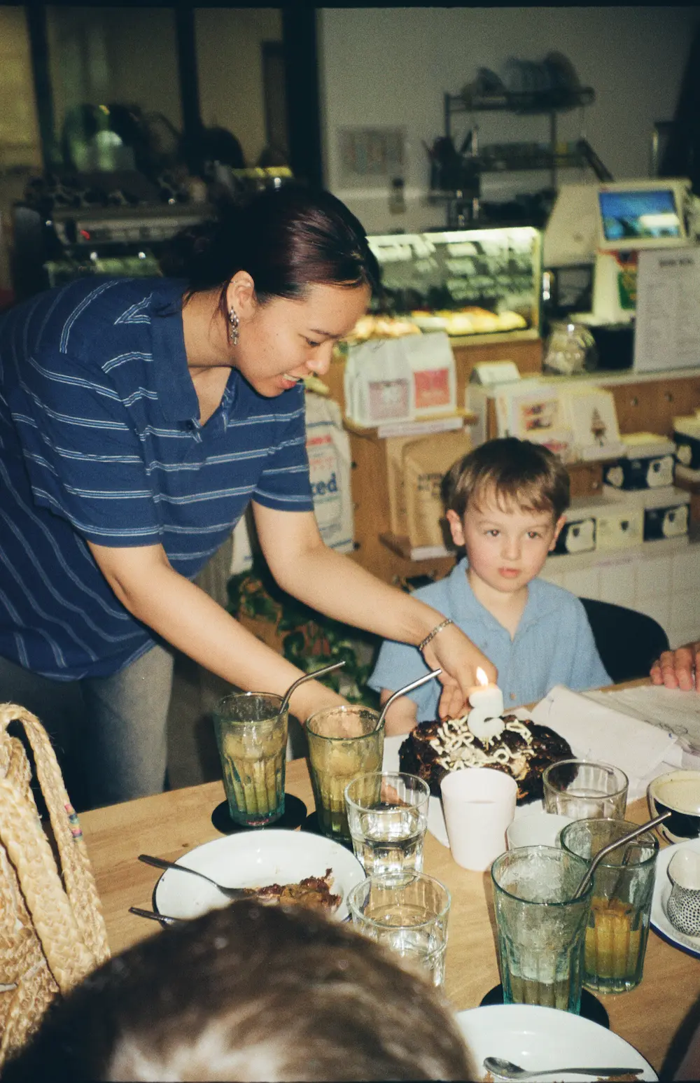 celebrating with a candle-lit chocolate cake